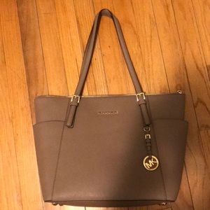 Selling my brown MK handbag. 1 yr old used 3 times